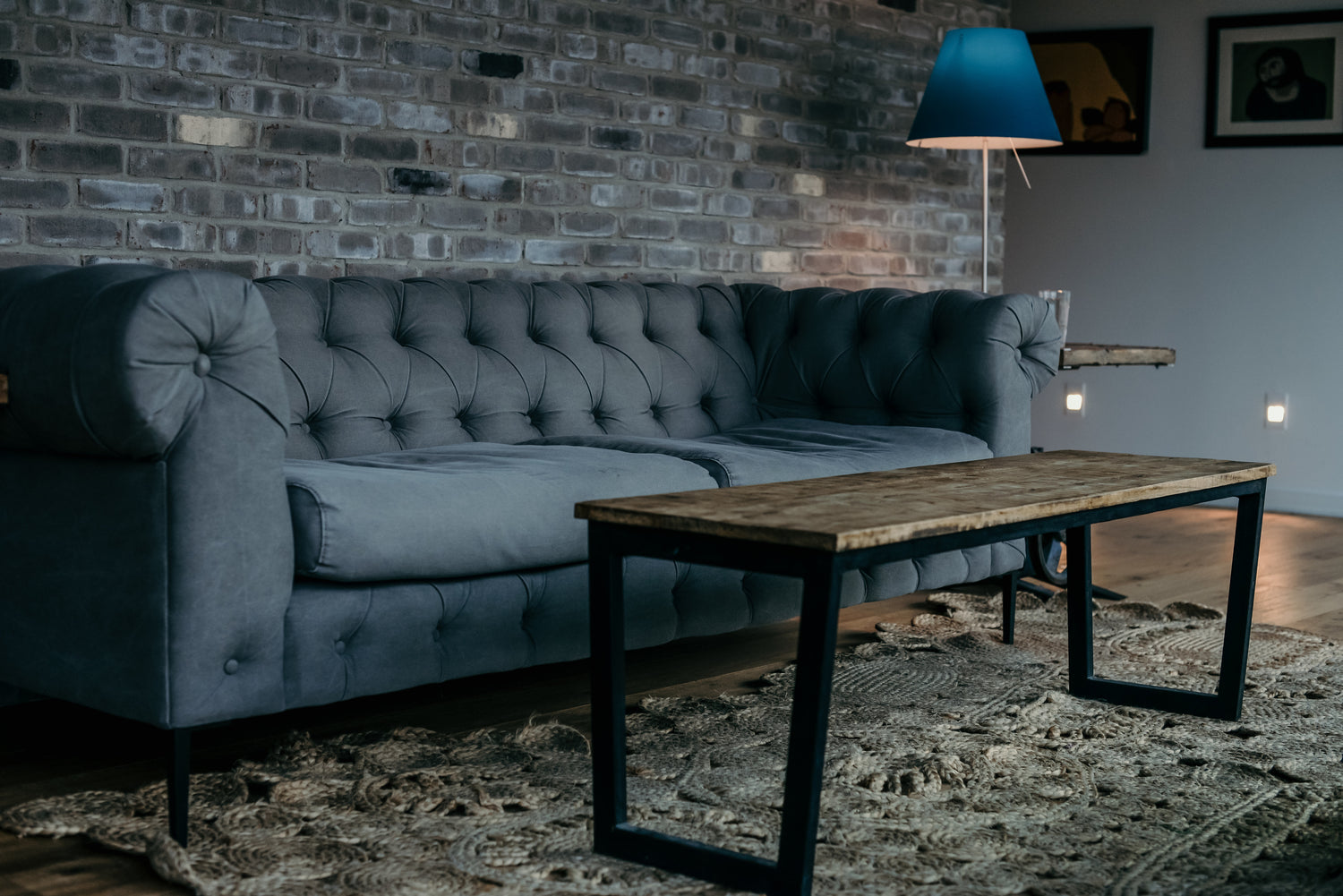 blue couch in a room with a wooden coffee table